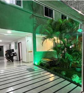 a room with a large aquarium in the middle of a building at Hotel Paraiso Go in Valparaíso de Goiás +14 photos