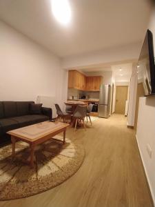 a living room with a couch and a table at Metsovo apartment in Metsovo