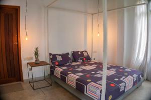a bedroom with a bed with a canopy at Idam Villa in Akmimana +12 photos