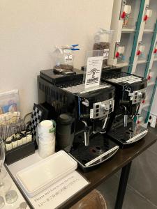 a counter with a coffee maker on a table at HOTEL CLA-SS HIROSHIMA-TOKAICHI in Hiroshima +26 photos