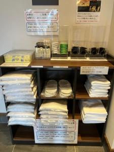a closet filled with lots of different types of towels at HOTEL CLA-SS HIROSHIMA-TOKAICHI in Hiroshima