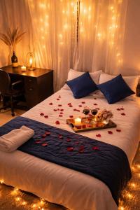 a bedroom with a bed with roses on it at Best Homestay in Alappuzha 4 BR- LAYANILA in Alleppey