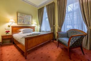 Postel nebo postele na pokoji v ubytování Grotthuss Boutique Hotel Vilnius + 37 fotografií