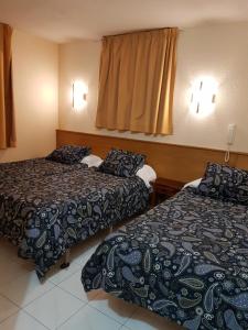 Tempat tidur dalam kamar di Hotel Arinsal