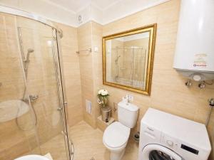 a bathroom with a toilet and a glass shower at Harmony 20 Sveti Vlas Private Apartment 211 in Sveti Vlas +24 photos
