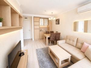 a living room with a couch and a table at Harmony 20 Sveti Vlas Private Apartment 211 in Sveti Vlas