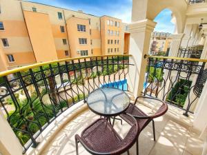 a balcony with a table and chairs on a balcony at Harmony 20 Sveti Vlas Private Apartment 211 in Sveti Vlas