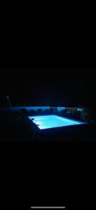 a dark picture of a pool of water at night at Perle rare Lodge in Diamond Island