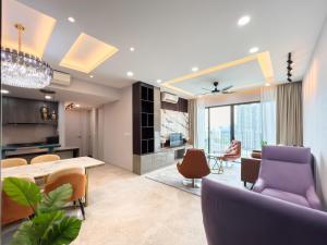a living room with a purple couch and chairs at Luxury Condo Datum Jelatek Near KLCC,free Parking in Kampong Datok Keramat