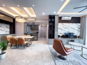 a dining room with a table and chairs at Luxury Condo Datum Jelatek Near KLCC,free Parking in Kampong Datok Keramat