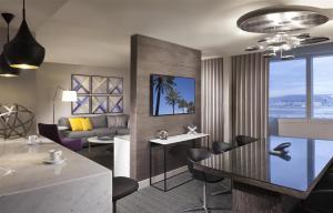 a living room with a table and a couch at Hyatt Regency Los Angeles International Airport in Los Angeles
