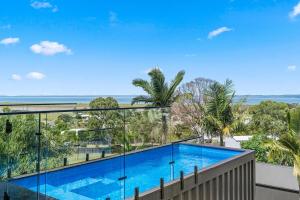 a view of a swimming pool from a balcony at Ocean Outlook Retreat in River Heads