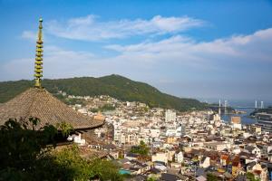 a view of a city with a tower at modern villa, asterisk ONOMICHI 2 in Onomichi