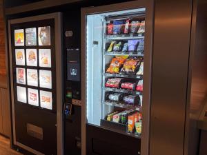 a refrigerator filled with lots of food and drinks at Hotel Oak Shizuoka in Shizuoka