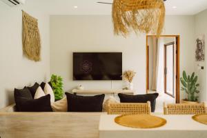 a living room with a couch and a tv at Karma Shana Residence in Lamai +46 photos