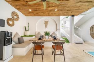 a living room with a table and chairs at Casa Sud - Secluded Pool Villa in Uluwatu in Uluwatu