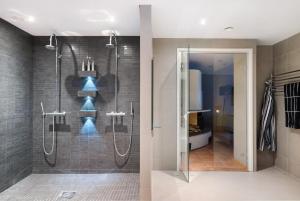 a bathroom with a shower with a glass door at Aurora Sky Villa in Rovaniemi +44 photos