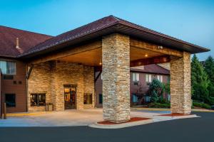 a large brick building with a roof at Riverview Inn & Suites, an Ascend Collection Hotel in Rockford