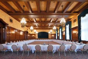 a large banquet hall with white tables and chairs at The Fort Garry Hotel, Spa and Conference Centre, an Ascend Collection Hotel in Winnipeg
