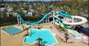 an aerial view of a water park at Mobilhome moderne avec grande terrasse, pergola, HUDIMESNIL in Hudimesnil