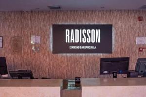 a sign on the wall of a building at Radisson Diamond Barranquilla in Barranquilla