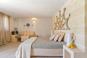 a bedroom with a bed in a room at Masseria Capricella in Fasano