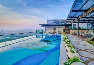 a swimming pool on the roof of a building at WelcomHotel by ITC Hotel Mohali, Chandigarh in Chandīgarh