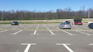 a parking lot with several cars parked in it at Apartament in Craiova