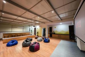 a room with four sleeping bags on the floor at C Suites Gilbert in Bangalore