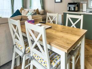a living room with a table and two chairs at Seren - Uk51711 in Cockermouth
