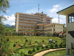 a large building with an elephant in front of it at Muong Thanh Lai Chau Hotel in Pan Linh