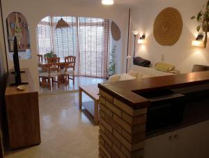 a living room with a couch and a table at Cala Morelló in Ifach