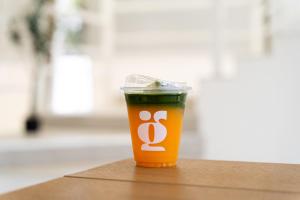 a orange coffee cup sitting on top of a table at Grood Glamping in Ban Khok Sung