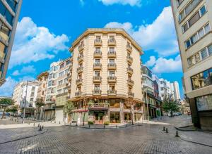 a tall building on a street in a city at Hotel Seren 2 in Istanbul