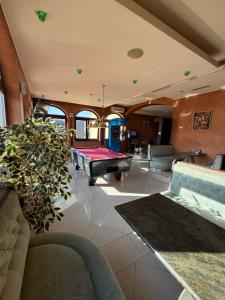 a large living room with a pool table in it at Apartments Šoić in Samobor