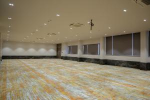 a large empty room with a large dance floor at King's Kraft Shubh Hotel in Dwarka +31 photos