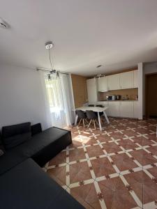 a living room with a couch and a table at Vievis Hotel Vievija in Vievis