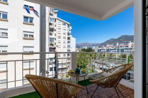a balcony with chairs and a table and a view at Stella Andrea Luxury Apartment in Bar