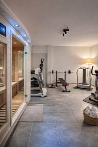 a gym with exercise equipment in a room at Allure villa in Porto Rafti +74 photos