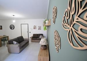 a living room with two couches and a table at La Casa di Zefiro in Santa Flavia