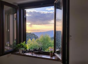 a window with a view of a mountain view at Casa Gioele by Holiday World in Bove