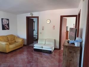 a living room with a couch and a chair at Casa Gioele by Holiday World in Bove +28 photos