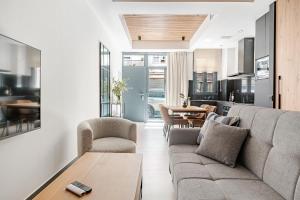 a living room with a couch and a table at Elcano Suites in Seville