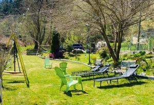 a group of chairs sitting in the grass at Casa Gallo Music Room in Lamon +33 photos