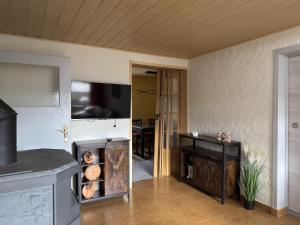 a kitchen with a counter and an open door at Ferienhaus in Altenfeld Thüringen mit Garten in Altenfeld