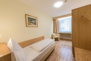 Postel nebo postele na pokoji v ubytování Hotel Windsor