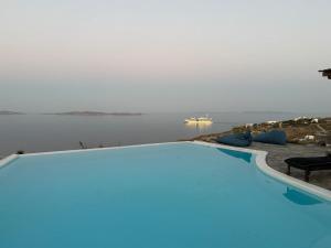 a swimming pool with a view of the water at Luxury Villa Dorothea Mykonos in Fanari +10 photos