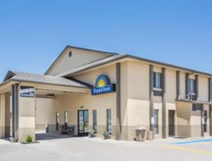 a hotel with a sign on the front of it at Days Inn by Wyndham Colby in Colby