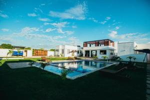 an external view of a house with a swimming pool at Nook Villas in Bagamoyo