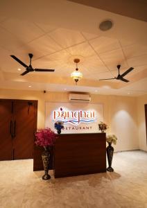 a lobby with a sign for a banquet at Hotel JMS Grand in Jaunpur